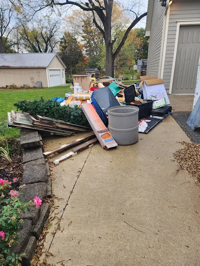 Dumpster being loaded with debris for Demolition Dumpster Rental in Brandon